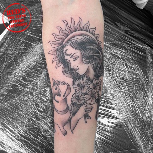 woman and dog tattoo